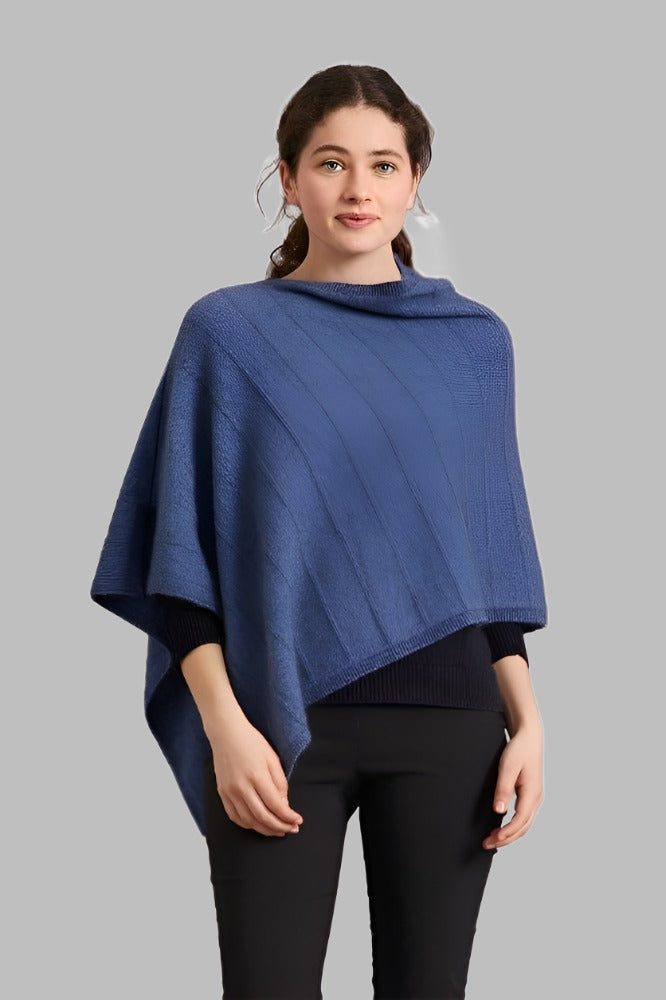 5007 Garter Detail Poncho - Elegance made easy with this garter detail.  Featuring diagonal garter detail and an asymmetric neck line, this piece is versatile and stylish.  35% Possum Fur, 55% Merino Wool, 10% Pure Mulberry Silk New Zealand designed and made Natural and sustainable One Size fits most