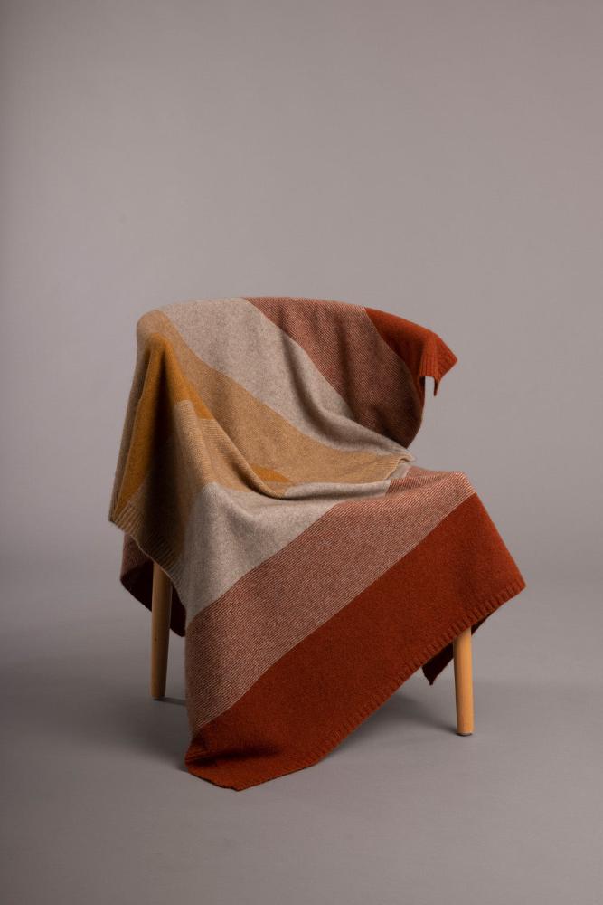 5020 Ombre Throw - Our beautiful Ombre Throw is perfect for keeping you warm both at home or when traveling! Featuring a tonal ombre pattern inspired by our best selling Ombre Poncho, this Possum Merino throw offers superior warmth, cosiness, and softness.