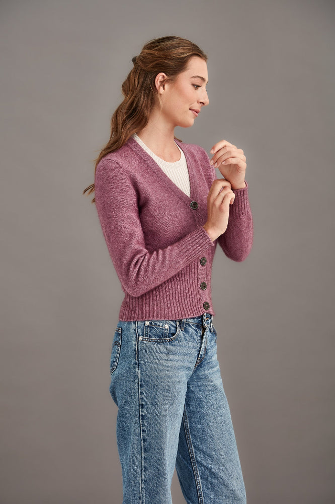 Possum and Merino  5034 Rib Cardi is knitted using our carefully sourced Natural Fibre blend of Possum Fur, Merino Wool and Mulberry Silk and finished with feature Shell Buttons, our Possum Merino Rib Cardi is a gorgeous take on a classic cardigan.  Rib detailing on the sleeve and hem partnered with a Deep V Neckline help to create a timeless, tailored look.