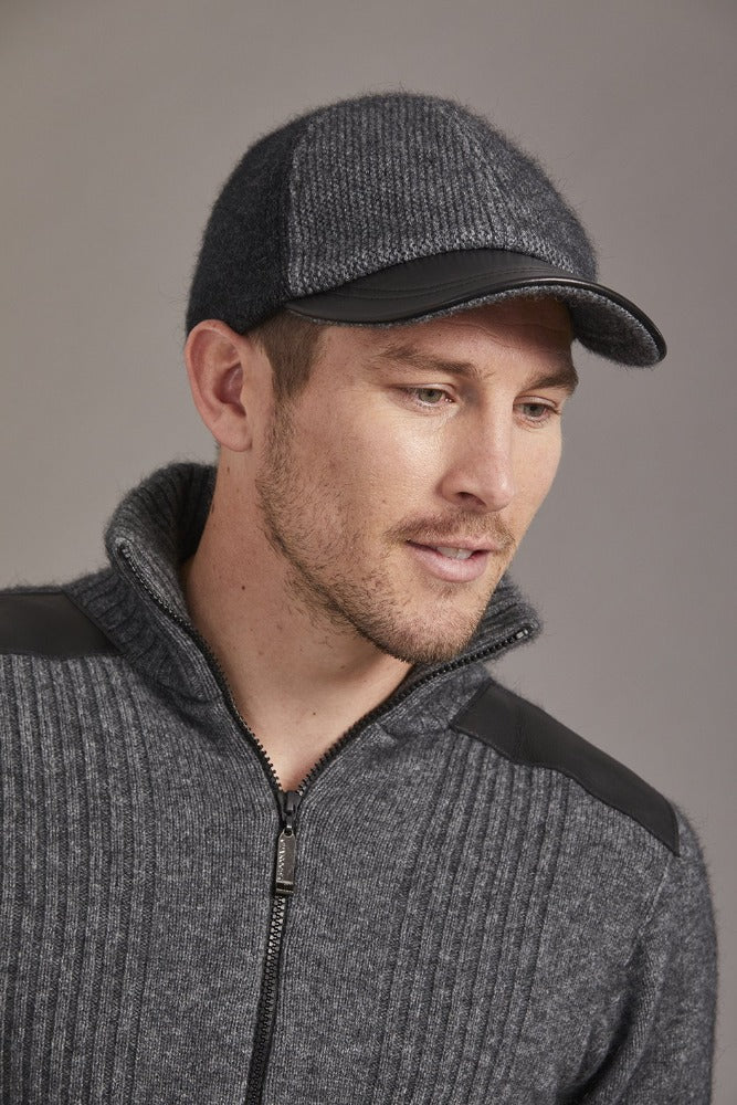 6071 Contrast Leather Peak Cap - Perfect piece for all ages, this Possum Merino cap is a timeless piece created with an artistic accent - keep the cold and the winter sun out. Step outdoors and make a statement. Intrinsically created from quality Possum Merino blended with luxurious Mulberry Silk and finished with a fine, genuine Lambskin Peak, you are sure to receive a quality warmth.