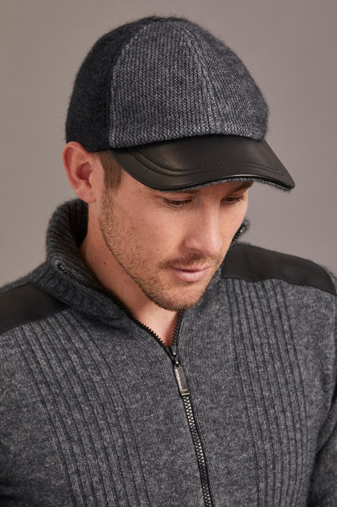 6071 Contrast Leather Peak Cap - Perfect piece for all ages, this Possum Merino cap is a timeless piece created with an artistic accent - keep the cold and the winter sun out. Step outdoors and make a statement. Intrinsically created from quality Possum Merino blended with luxurious Mulberry Silk and finished with a fine, genuine Lambskin Peak, you are sure to receive a quality warmth.