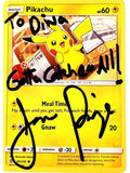 Pikachu trading card with handwritten text and autographs on a yellow background