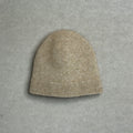 Beige knit baby beanie on a gray background