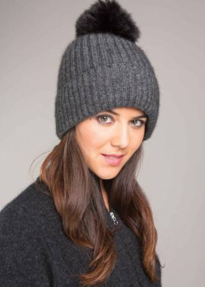 Possum and Merino.  KO2013 Fur Pom Pom Beanie - This Fur Pom Pom Beanie is made from a luxurious blend of possum fur and superfine New Zealand Merino wool.  So soft and warm you’ll never want to take it off.  Make a set with KO1018 Fur Pom Pom Scarf.  One size.  Made proudly in New Zealand from a premium blend of 40% possum fur, 50% merino lambswool & 10% mulberry silk.