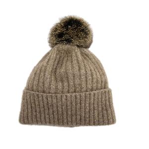 Possum and Merino.  KO2013 Fur Pom Pom Beanie - This Fur Pom Pom Beanie is made from a luxurious blend of possum fur and superfine New Zealand Merino wool.  So soft and warm you’ll never want to take it off.  Make a set with KO1018 Fur Pom Pom Scarf.  One size.  Made proudly in New Zealand from a premium blend of 40% possum fur, 50% merino lambswool & 10% mulberry silk.