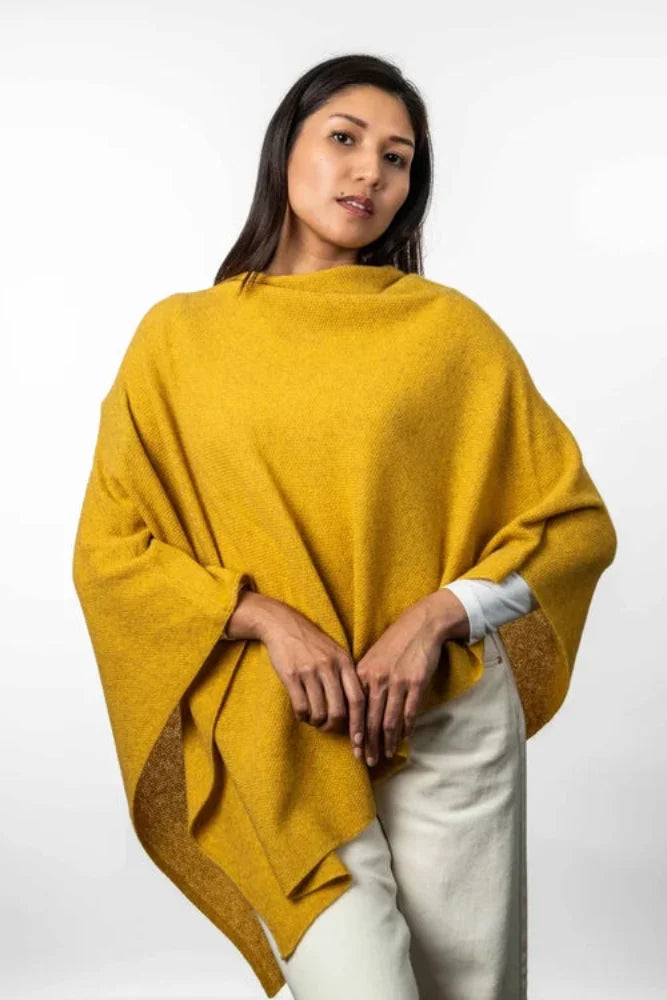 Possum and Merino  KO798 Two Way Poncho - This is a versatile and lightweight piece which can be worn two ways - with the hem either straight across or on the diagonal.   One Size   Made proudly in New Zealand from a premium blend of 40% possum fur, 50% merino lambswool & 10% mulberry silk.