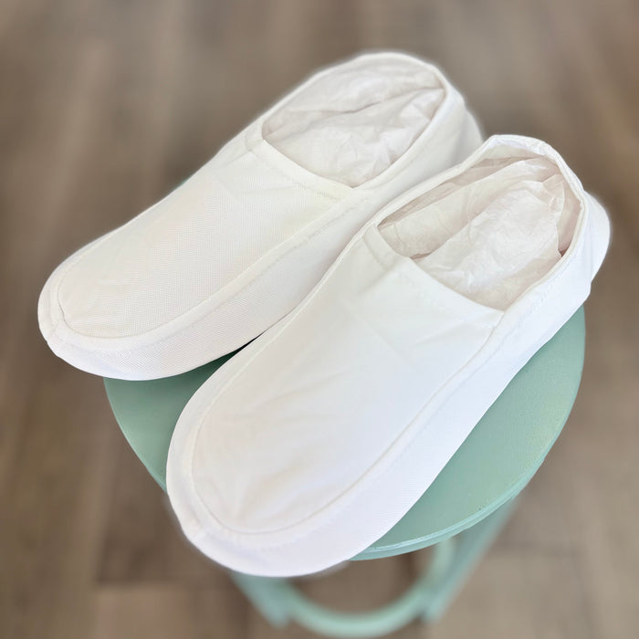 Plain white soft slippers for men.