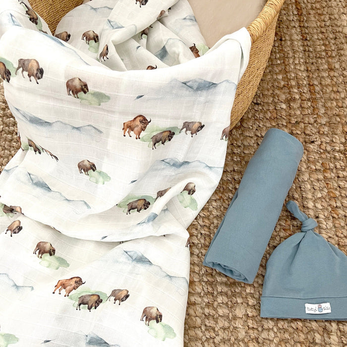 Lightweight organic cotton swaddle with nature-inspired design