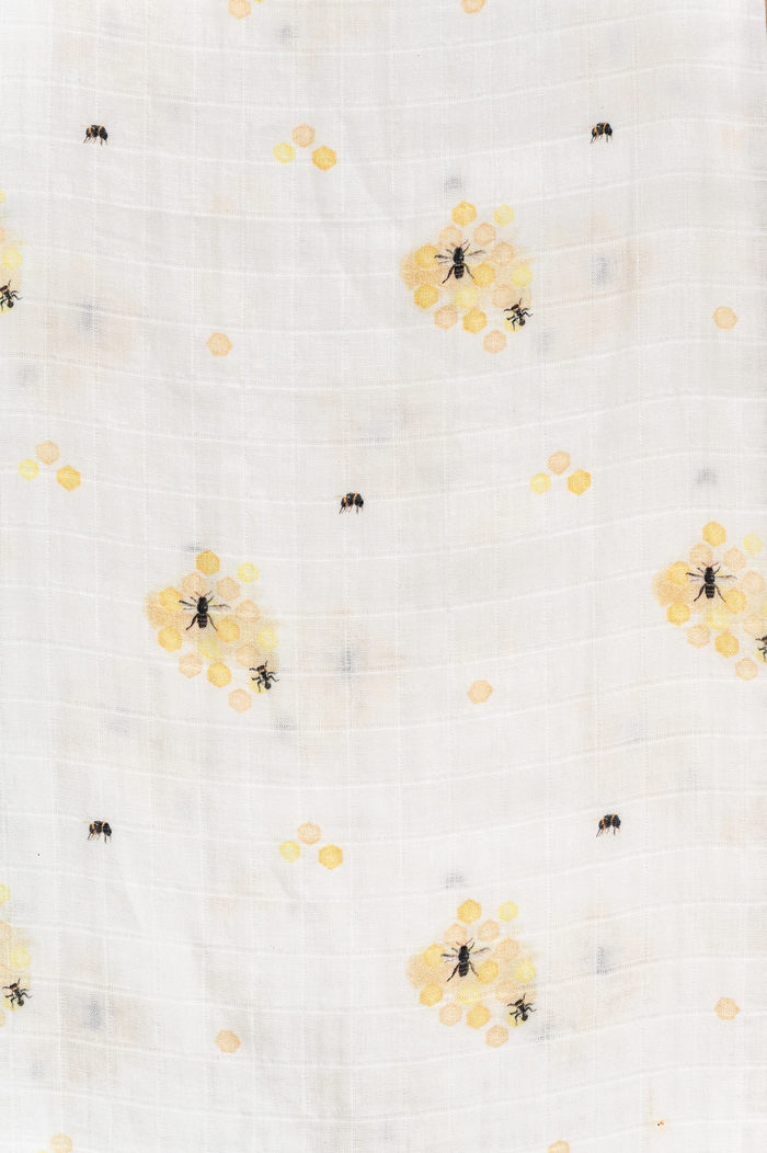 Lightweight organic cotton swaddle with bee print