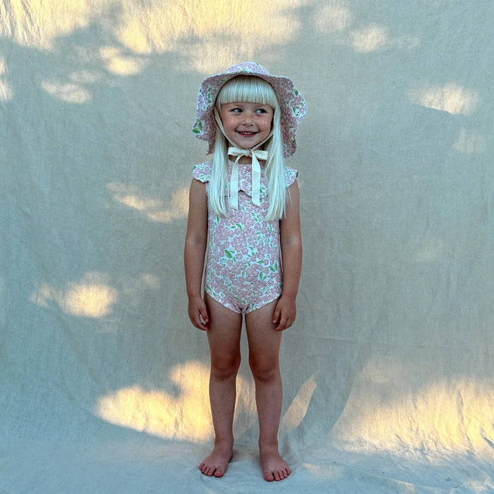 Petit Playa Petal Swimsuit in Peony print, sun-safe UPF50+ swimwear for babies and girls