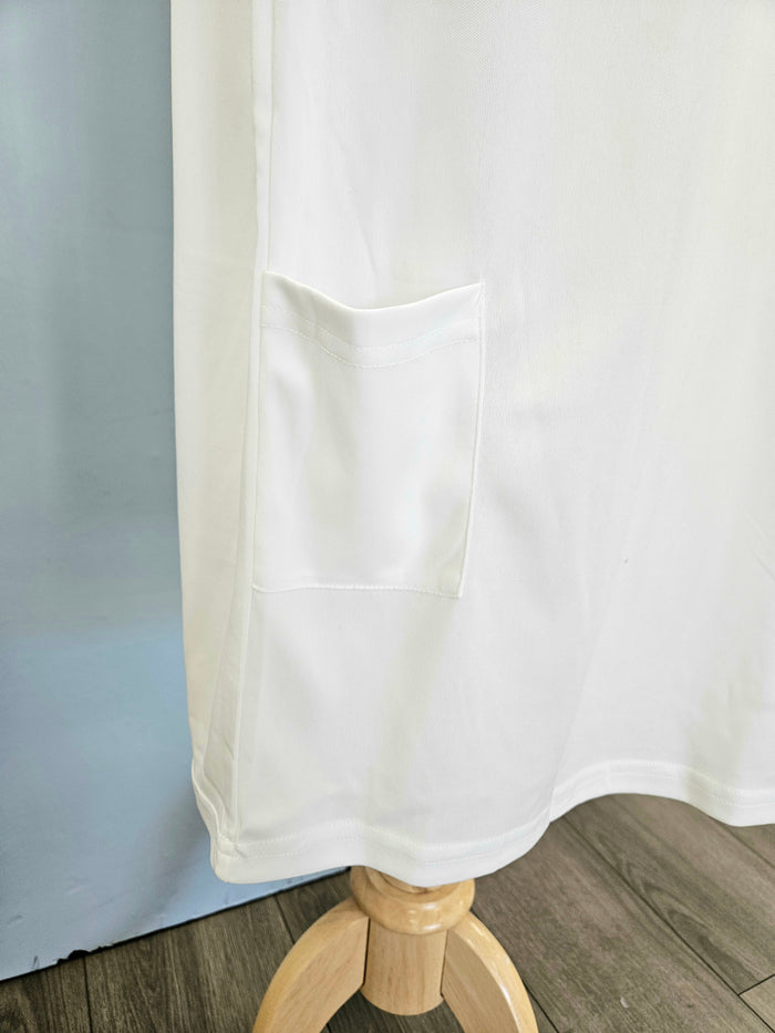 Raglan sleeve full length slip with pocket at hem.