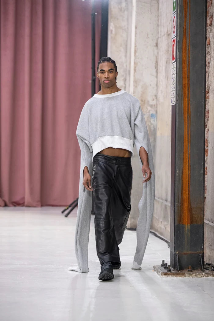 MANCANDY Trans Wrap Sweatshirt with extended wrap-around sleeves and transformable oversized silhouette.