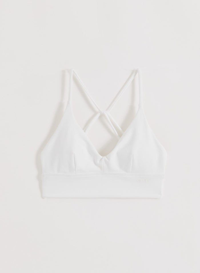 Valkoinen aim'n Sense Strap Bra, jossa on koristeelliset selkähihnat ja second skin -tuntu.